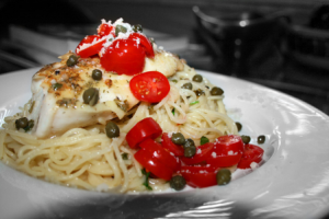 Cod with pasta and cherry tomatoes