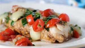 Pan fried cod with spinach and cherry tomatoes
